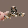 Crystal Pearl embellished hair claw in Dhak