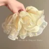 yellow multi ayered pearl hair tie.